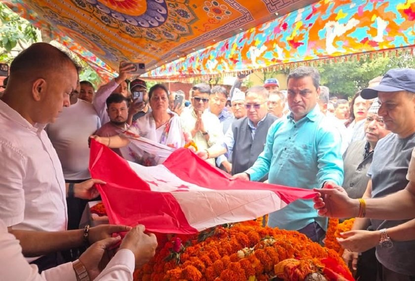 Former Minister Rajendra Kharel Honored with Party Flag at Congress Headquarters