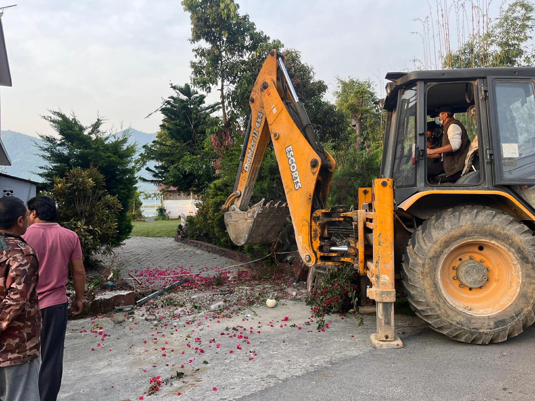 Bulldozers demolish structures at Karna Shakya's Waterfront Hotel in Pokhara