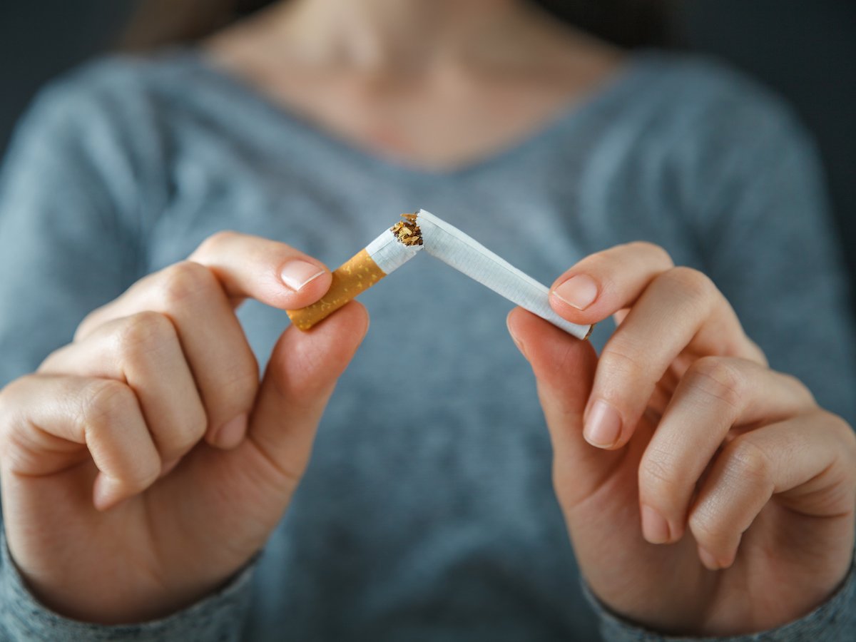 Woman Breaking Cigarette
